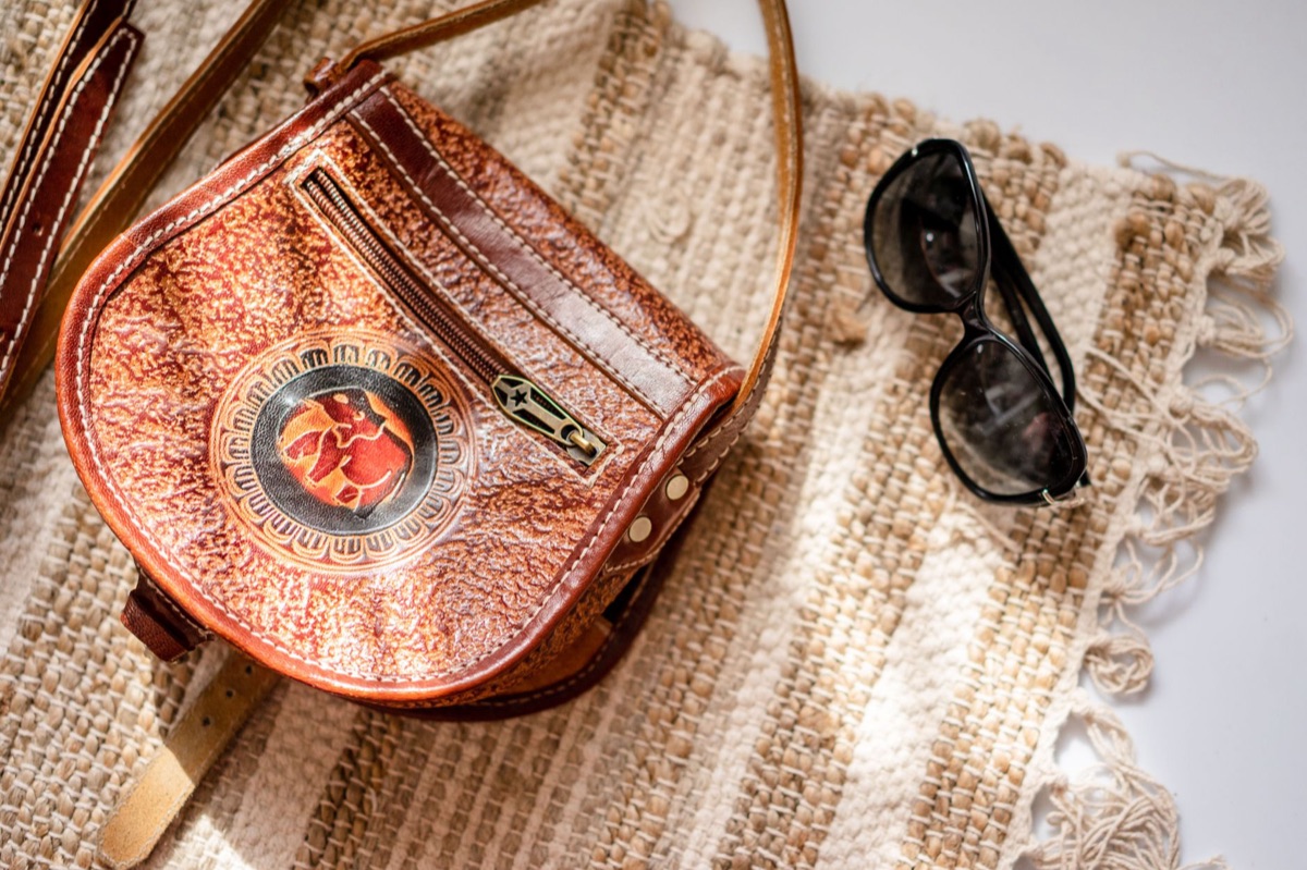 Close-up shot of a serial number embossed on the leather lining of a luxury bag.