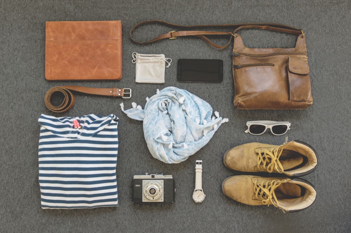 Close up of a tiny shoulder bag against a simple modern outfit