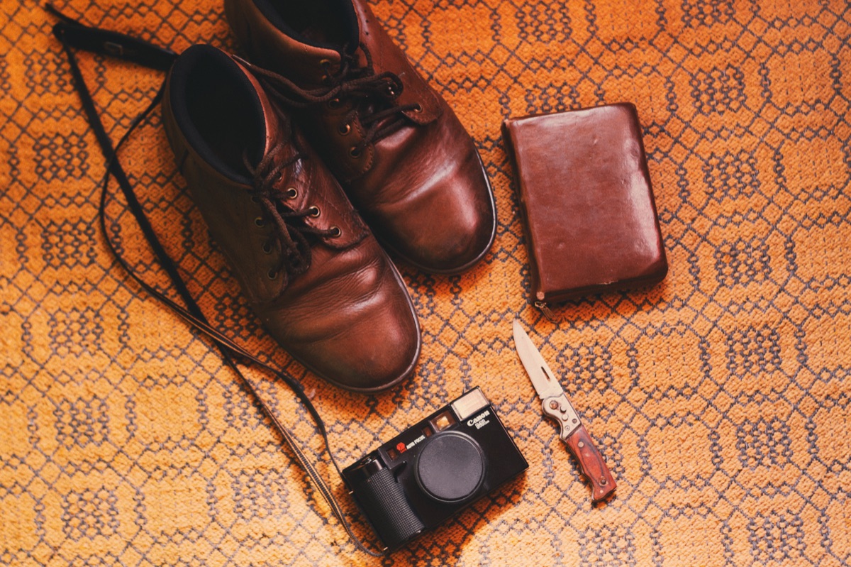 Flat lay composition showing small bag alongside keys and sunglasses